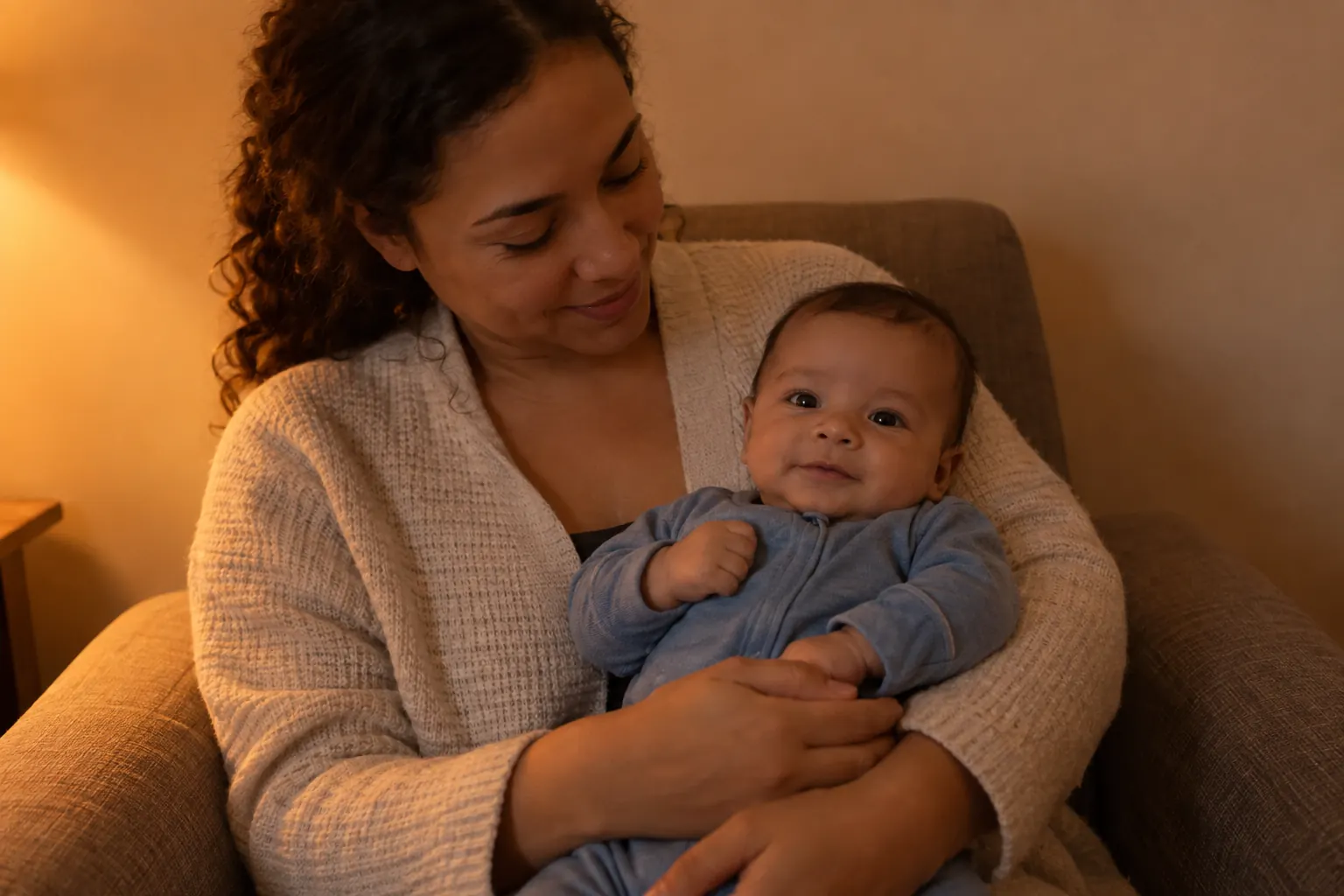 Synthetic evening phone photo of a parent holding a baby with a strong warm orange color cast